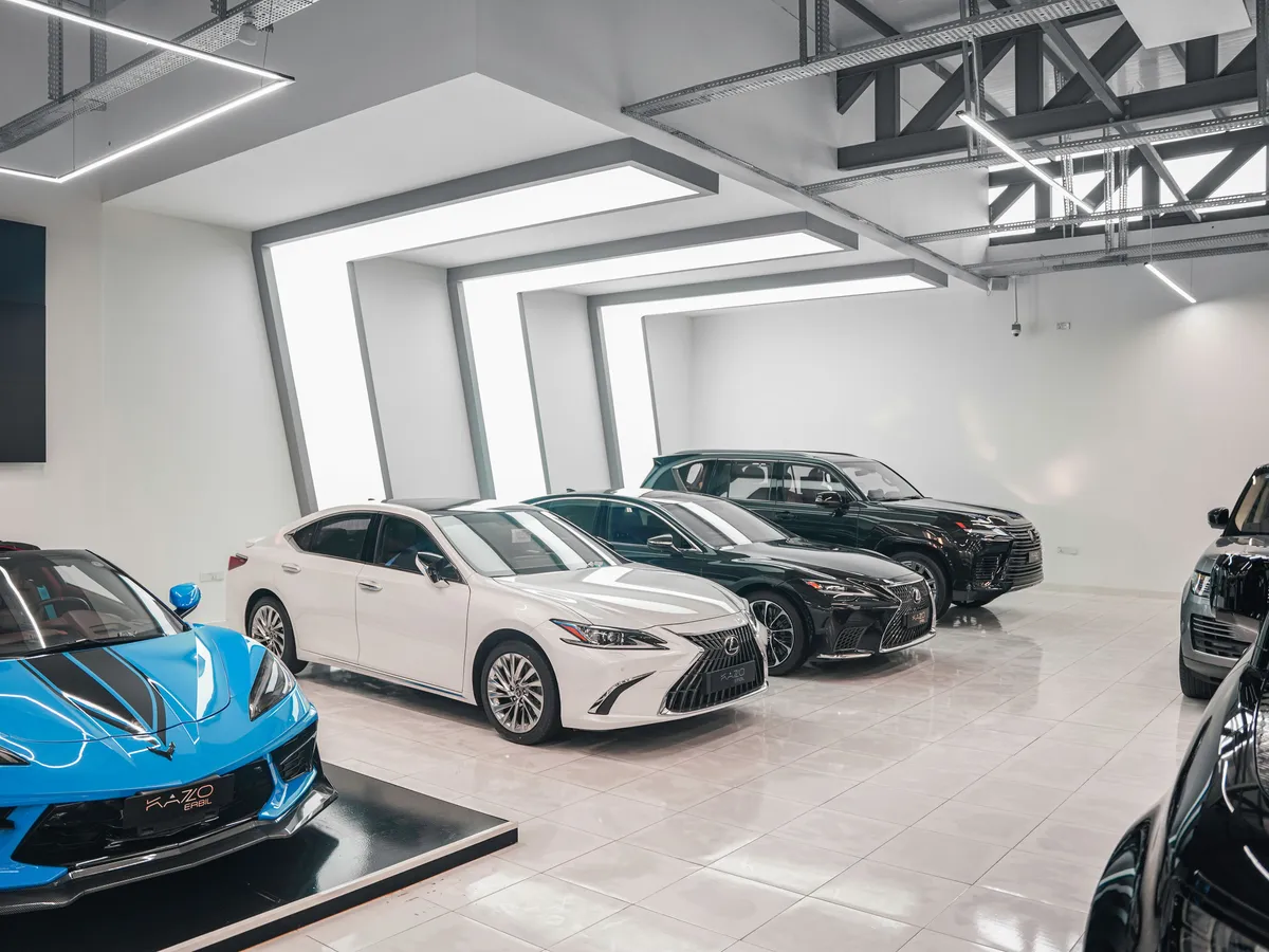 Cars on display inside a modern dealership showroom