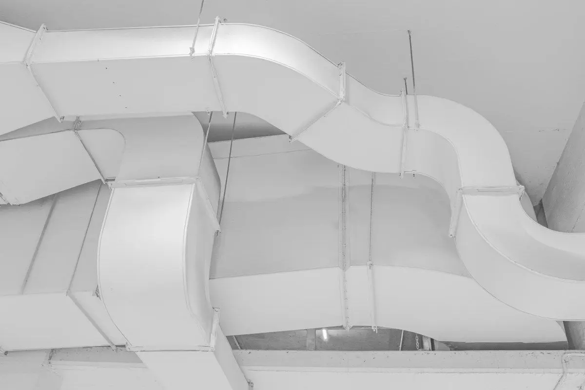 New sheet-metal HVAC ductwork running across a ceiling