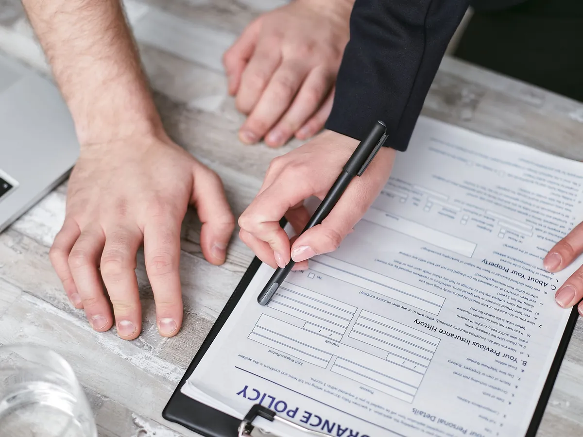 Car insurance documents reviewed with an agent
