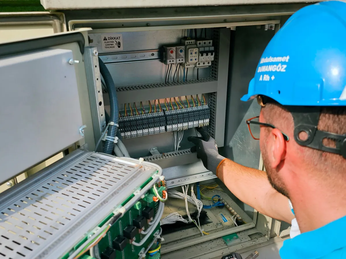 Electrician servicing a home standby generator