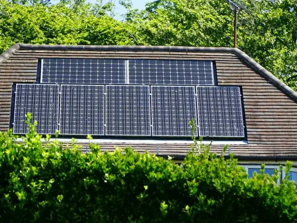 Solar panels installed on the roof of a suburban house