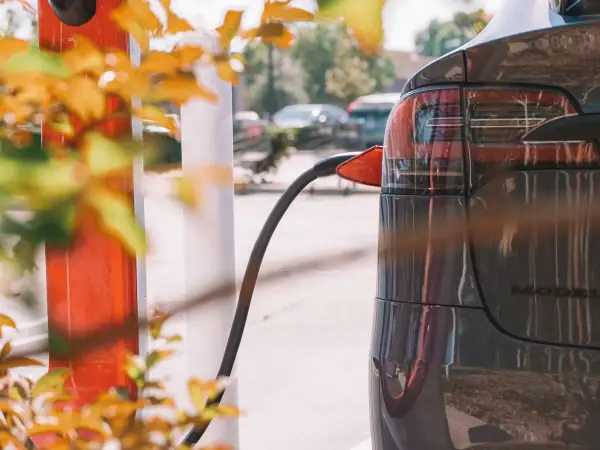Electric car plugged into a charging station
