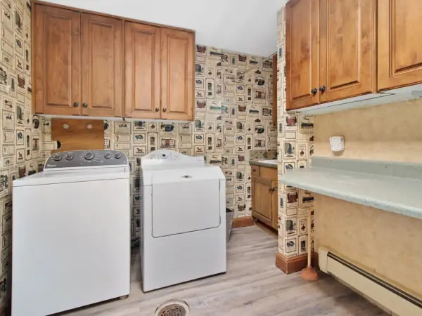 Washer and dryer side by side in a home laundry room